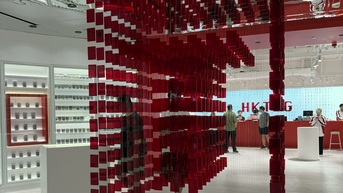 Suspended red plaques align into a large T at the centre of HKTCG.